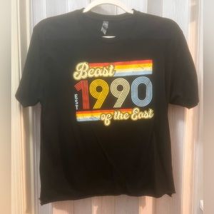 Next Level Apparel top. Black colored with the writing “Beast 1990 of the East”